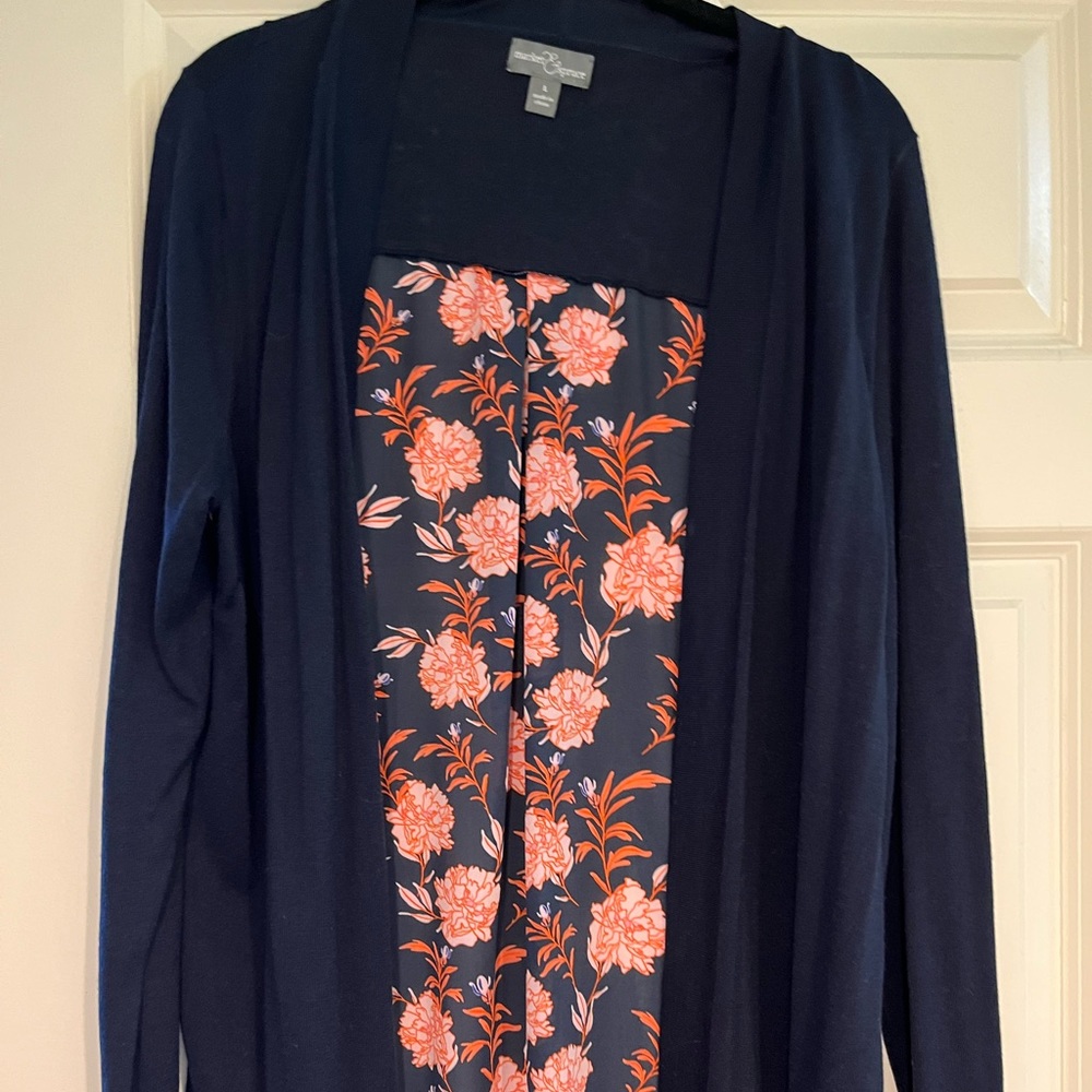 Navy blue cardigan with floral detail on back. New without tags.